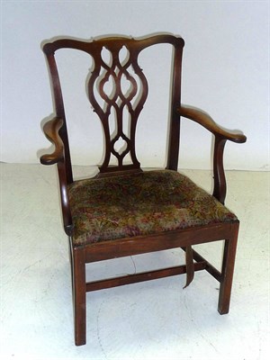 Lot 1463 - A George III Mahogany Elbow Chair, the back with undulating toprail and pierced splat between...