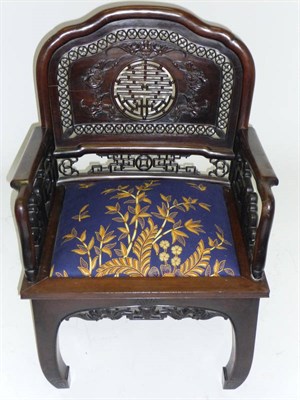 Lot 1465 - A Chinese Hardwood Armchair, probably late 19th century, the shaped back with pierced decoration of