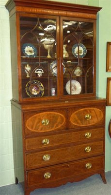 Lot 1469 - A Late George III Mahogany Crossbanded Secretaire Bookcase, the projecting cornice above a...