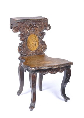 Lot 1471 - A Swiss Marquetry Inlaid Linden Wood Smoking Chair, circa 1900, the shaped back support with...