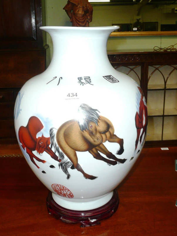 Lot 434 - Oriental vase decorated with horses, with stand