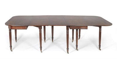 Lot 1485 - A Regency Mahogany Extending Dining Table, the round-cornered top on a gateleg frame with...