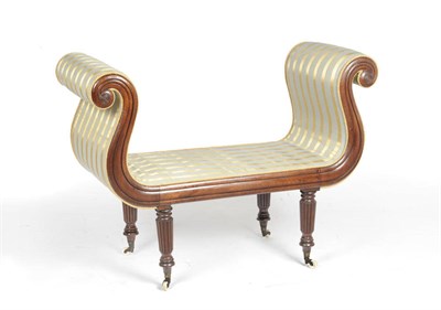 Lot 1488 - A Regency Mahogany-Framed Window Seat, upholstered in a grey-blue and gold striped fabric, the...