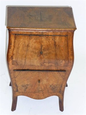 Lot 1490 - An 18th Century Italian Walnut Bombé Small Chest, the moulded top above two deep drawers and...