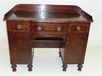 Lot 1491 - A Mahogany Breakfront Sideboard, mid 19th century, the three-quarter gallery back above a...