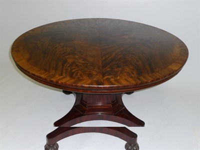 Lot 1492 - A Flame Mahogany Circular Dining Table, mid 19th century, the radically veneered circular top...