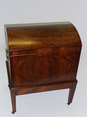 Lot 1493 - A Late George III Mahogany Cellaret, the domed top opening to reveal a fitted interior (the...