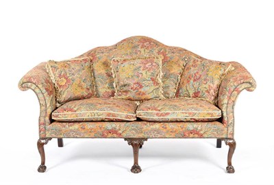 Lot 1496 - A Pair of Settees in the George II Style, upholstered in floral damask, the undulating back between