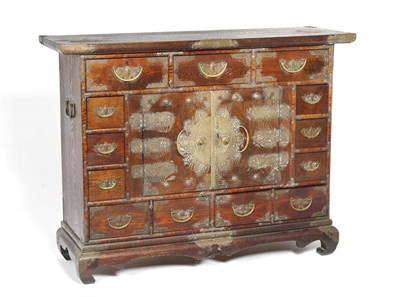 Lot 1502 - A Japanese Ash and Copper-Mounted Tansu or Chest, the moulded top over an arrangement of...