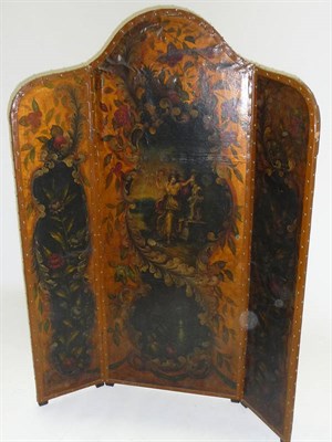 Lot 1512 - A Painted and Gilt Leather Screen, of three leaves comprising an arched centre and two flanking...