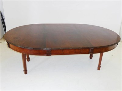 Lot 1516 - A Mahogany Wind-Out Dining Table, the top with a leaf-reeded edge and half-round ends, a plain...