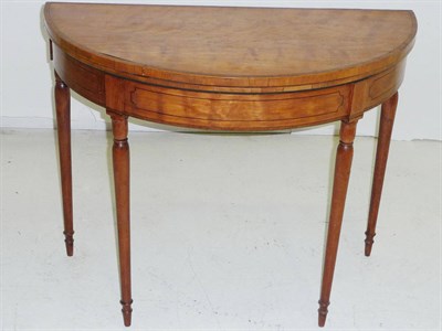 Lot 1526 - A George III Satinwood Crossbanded Foldover Card Table, the demi-lune hinged top above a plain...