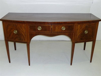 Lot 1540 - A George III Inlaid Mahogany Bowfront Sideboard, the shaped top above a two-as-one central...