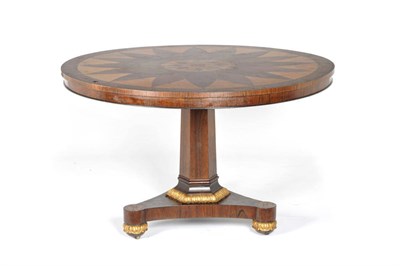 Lot 1544 - An Early 19th Century Rosewood and Brass Inlaid Loo Table, the circular top veneered with a...