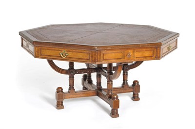 Lot 1558 - An Octagonal Table, the moulded top inset with tooled red leather, over four drawers to the...