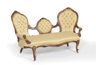 Lot 1561 - A Victorian Walnut Framed Settee, upholstered in yellow gold silk damask, the double rounded...