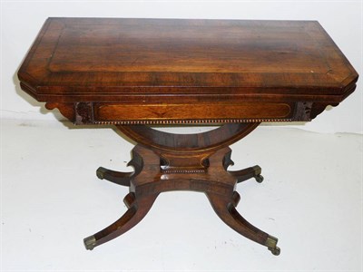 Lot 1565 - A Regency Rosewood and Brass Inlaid Foldover Card Table, the rectangular brass strung top with...