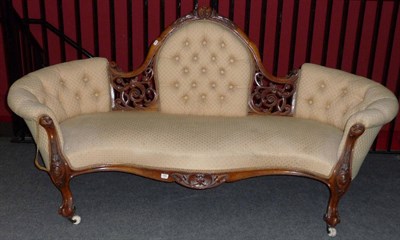 Lot 1566 - A Victorian Walnut Framed Settee, upholstered in yellow/beige button back damask, the arched...