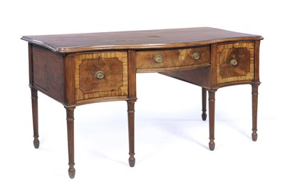 Lot 1567 - A Regency Mahogany Serpentine Sideboard, the top veneered with plum-pudding mahogany, over a frieze