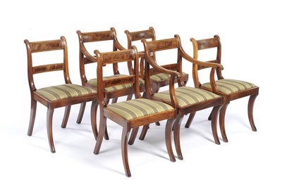 Lot 1568 - A Set of Six Regency Mahogany and Rosewood Dining Chairs, the two armchairs with rectangular strung