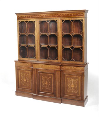 Lot 1582 - A Sheraton Revival Mahogany and Satinwood Banded Triple Door Bookcase, late 19th century, the...