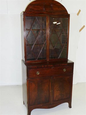 Lot 1588 - A Regency Mahogany Secretaire Bookcase, the architectural rounded top above two astragal glazed...