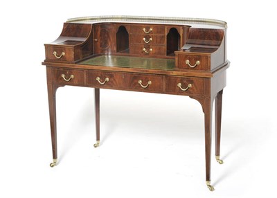 Lot 1598 - An Edwardian Inlaid Mahogany Carlton House Desk, the curved superstructure with pierced brass...