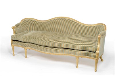 Lot 1603 - A George III Giltwood Settee, upholstered in green crushed satin, the serpentine shaped back with a