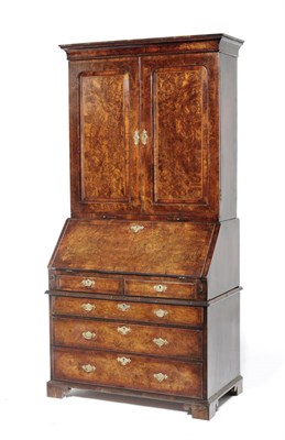 Lot 1618 - An 18th Century Walnut Bureau Bookcase, the projecting moulded cornice above a plain frieze and two