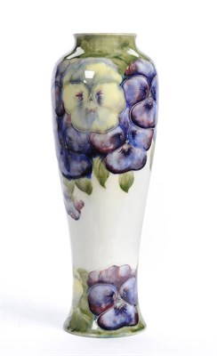 Lot 1622 - A William Moorcroft "Pansy" Vase, on a white ground, printed brown factory mark, painted green...