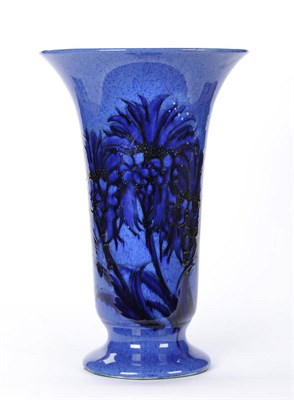 Lot 1625 - A William Moorcroft "Cornflower" Trumpet Vase, on a powder blue ground, painted blue signature,...