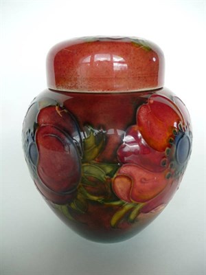 Lot 1627 - A Walter Moorcroft Flambe "Anemone" Ginger Jar and Cover, impressed factory marks, 12cm