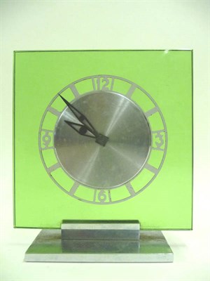 Lot 1680 - An Art Deco Green Glass and Chrome Timepiece, by Le Coultre Co, the 14cm square face mounted with a