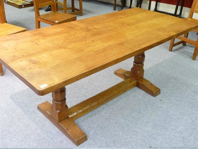 Lot 1704 - A Robert "Mouseman" Thompson Oak 6' Four Plank Refectory Table, with dowelled top, raised on...