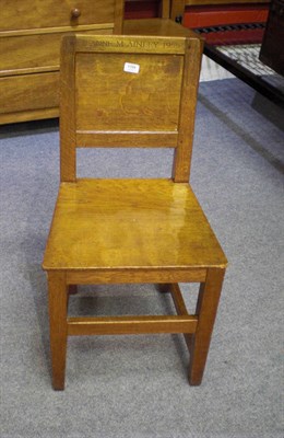 Lot 1709 - A Robert "Mouseman" Thompson Oak Panel Back and Seat Chair, on square section legs, joined by a...