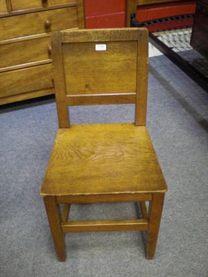 Lot 1710 - A Robert "Mouseman" Thompson Oak Panel Back and Seat Chair, on square section legs, joined by a...