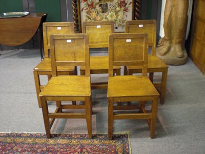 Lot 1712 - Five Robert "Mouseman" Thompson Oak Panel Back and Seat Chairs, on square section legs, joined by a