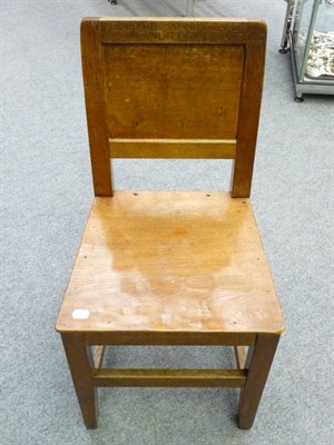 Lot 1713 - Four Robert "Mouseman" Thompson Oak Panel Back and Seat Chairs, on square section legs, joined by a