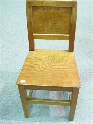 Lot 1719 - Five Robert "Mouseman" Thompson Oak Panel Back and Seat Chairs, on square section legs, joined by a