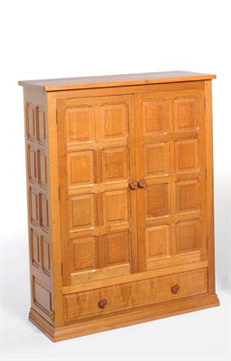 Lot 1723 - A Colin "Beaverman" Almack Panelled 4' Oak Cupboard, with two doors enclosing three shelves above a