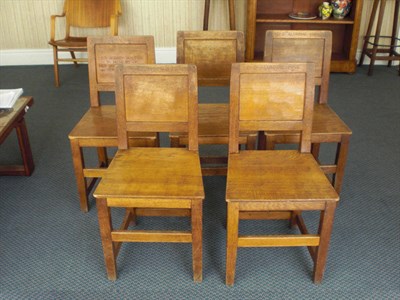 Lot 1722A - Five Robert "Mouseman" Thompson Oak Panel Back and Seat Chairs, on square section legs, joined...