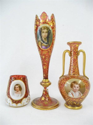 Lot 6 - A Ruby Glass, Painted and Parcel Gilt Two-Handled Pedestal Vase, Bohemia, circa 1870, of...