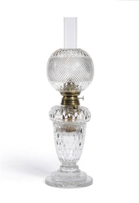 Lot 8 - A Cut Glass Table Oil Lamp, circa 1880, the spherical shade with tight diamond lozenge cut main...