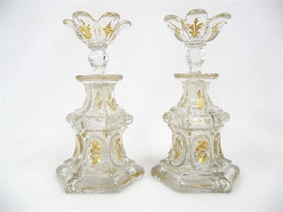 Lot 17 - A Pair of French Clear Glass and Parcel Gilt Hexagonal Scent Bottles and Stoppers, circa 1885,...