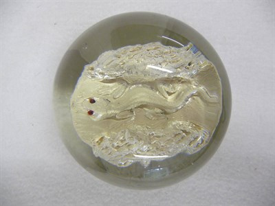 Lot 26 - A Sulphide Lizard Paperweight, English, circa 1850-60, the small red-eyed lizard crawling...