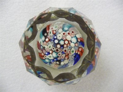 Lot 31 - An English Faceted and Millefiori Paperweight, with a dense arrangement of variously coloured...