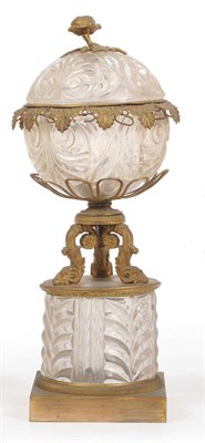 Lot 33 - A French Ormolu and Cut Glass Mounted Pedestal Jar and Cover, perhaps Baccarat,  circa 1830-40, the