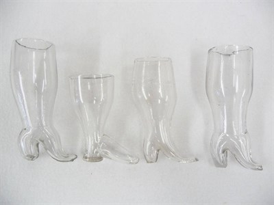 Lot 38 - A Group of Four Boot Shape Stirrup Cups, early 19th century, graduating 13-19cm