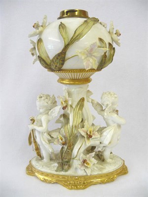 Lot 84 - A Moore Bros Encrusted Porcelain Table Oil Lamp, circa 1880, the scrolled and partly gilded...