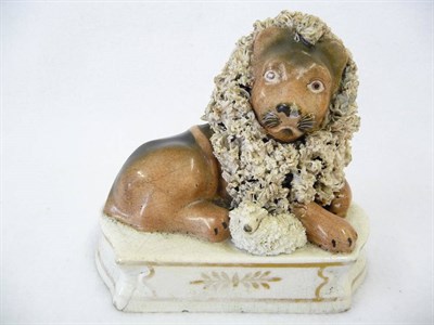 Lot 97 - A Shelton Type Pottery Figure of a Lion and Lamb, circa 1830, the king of the beasts with well...